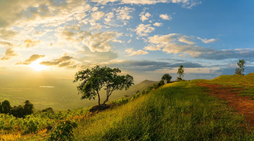 Mountain landscape with colorful vivid sunset on the cloudy sk